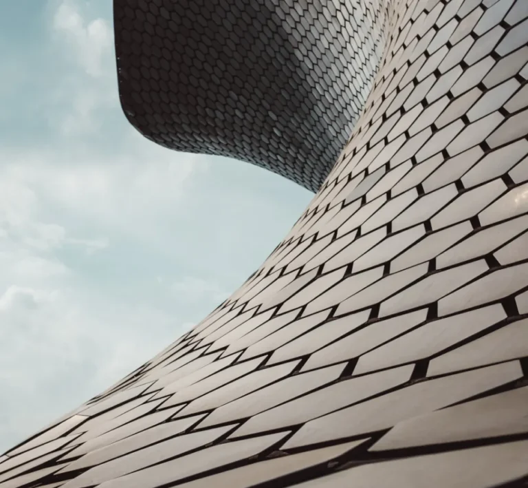 Sweeping contemporary architecture with an interconnected geometric facade